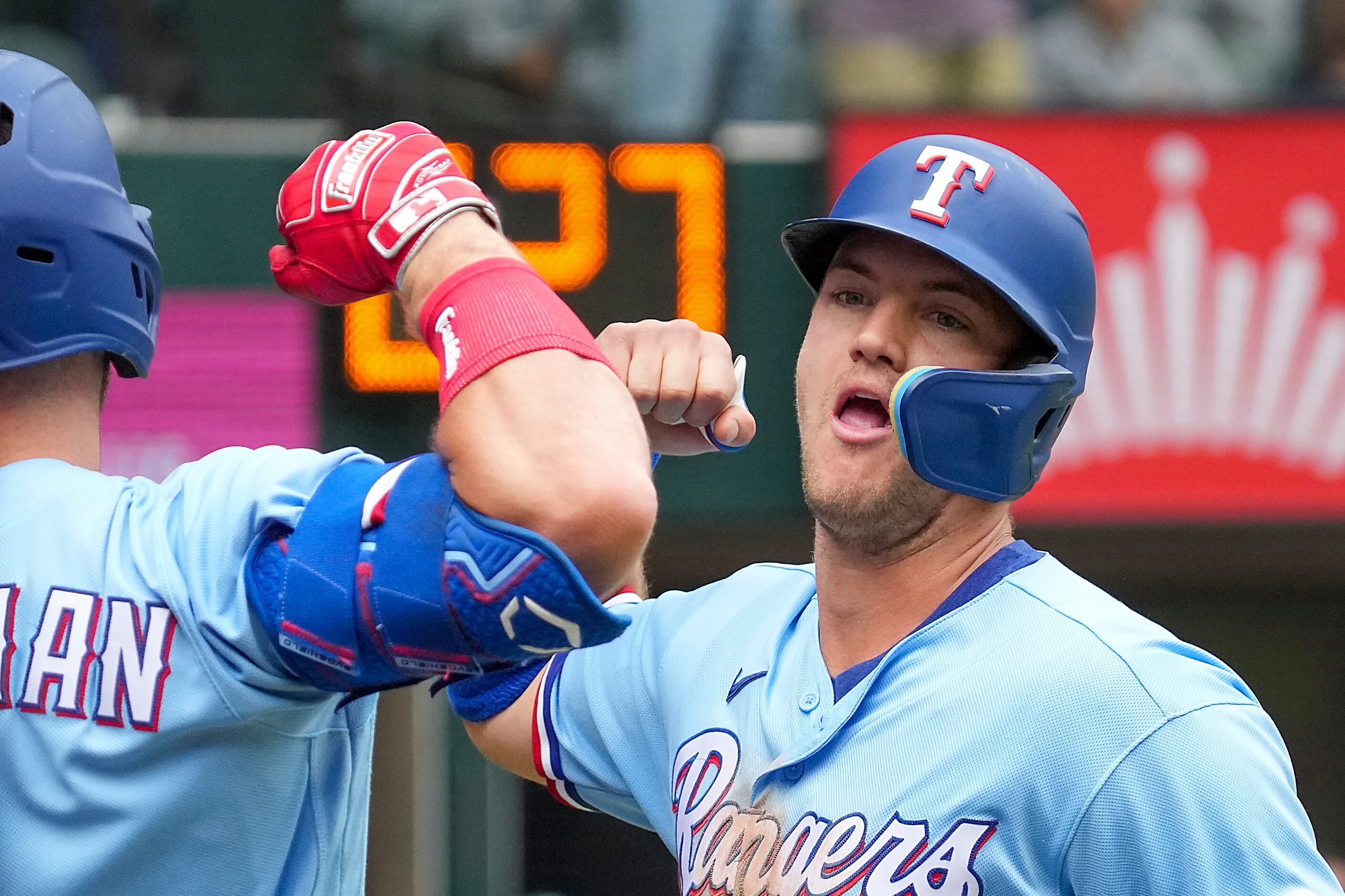 Texas Rangers third baseman Josh Jung celebrates with left fielder Robbie Grossman after...