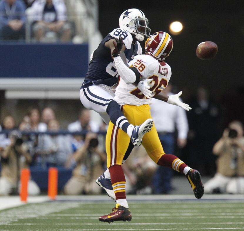 Dallas Cowboys wide receiver Dez Bryant (88) is interfered with by Washington Redskins...