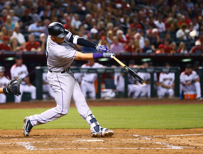 Apr 4, 2016; Phoenix, AZ, USA; Colorado Rockies shortstop Trevor Story hits a three run home...