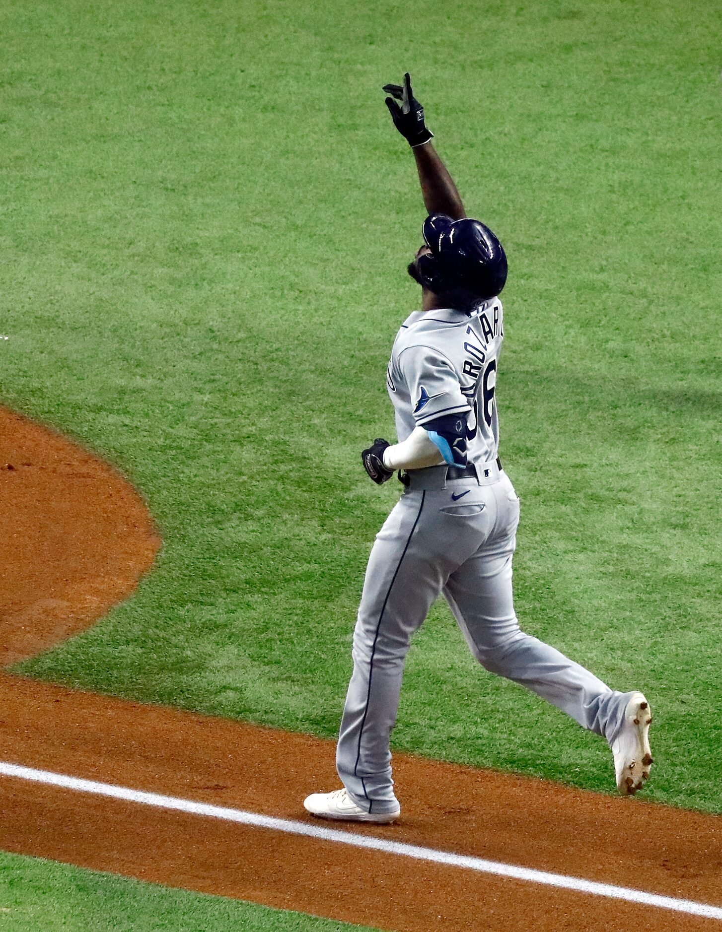 Tampa Bay Rays left fielder Randy Arozarena (56) rounds the bases after his first inning...