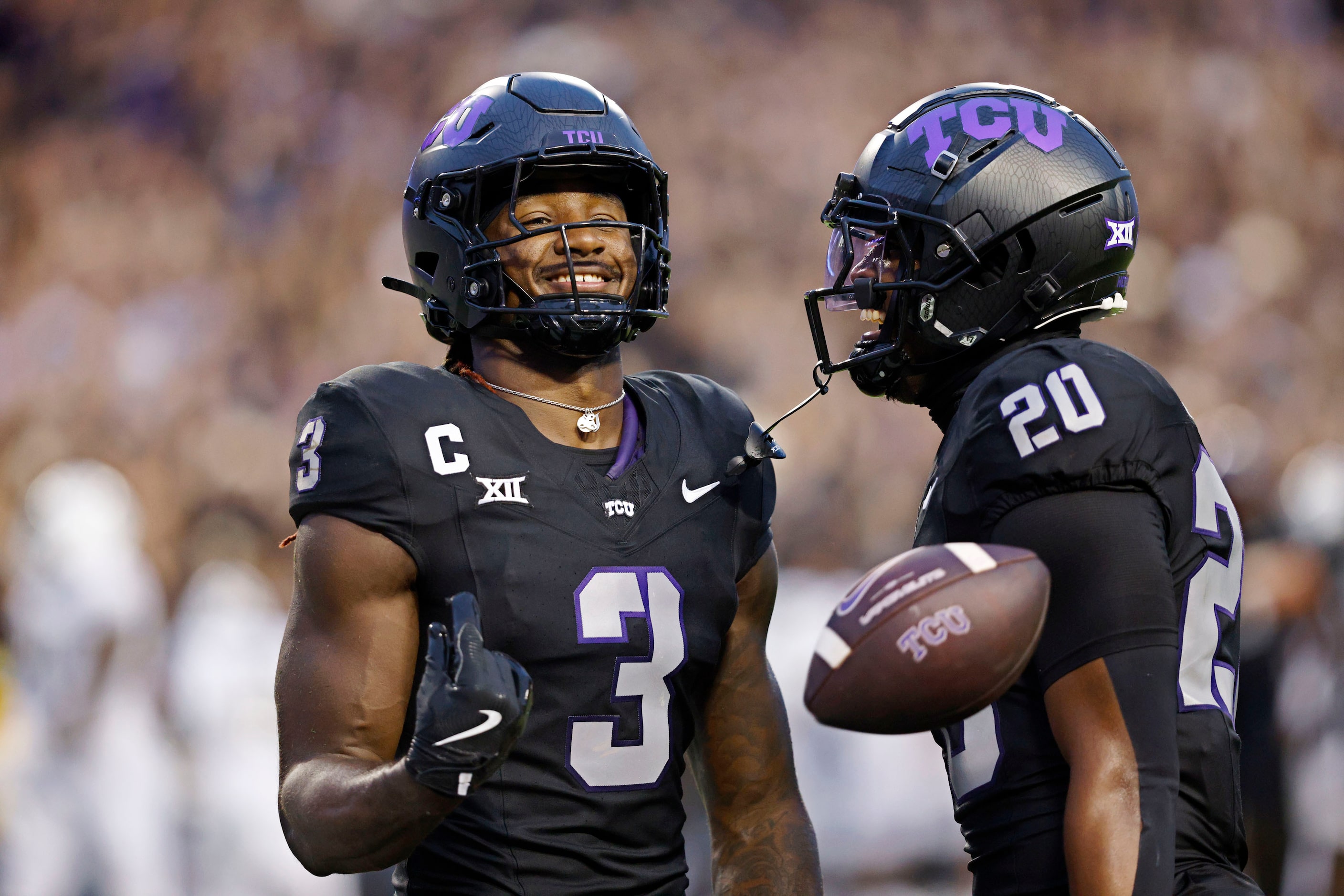 TCU wide receiver Savion Williams (3) celebrates his touchdown with his teammate running...