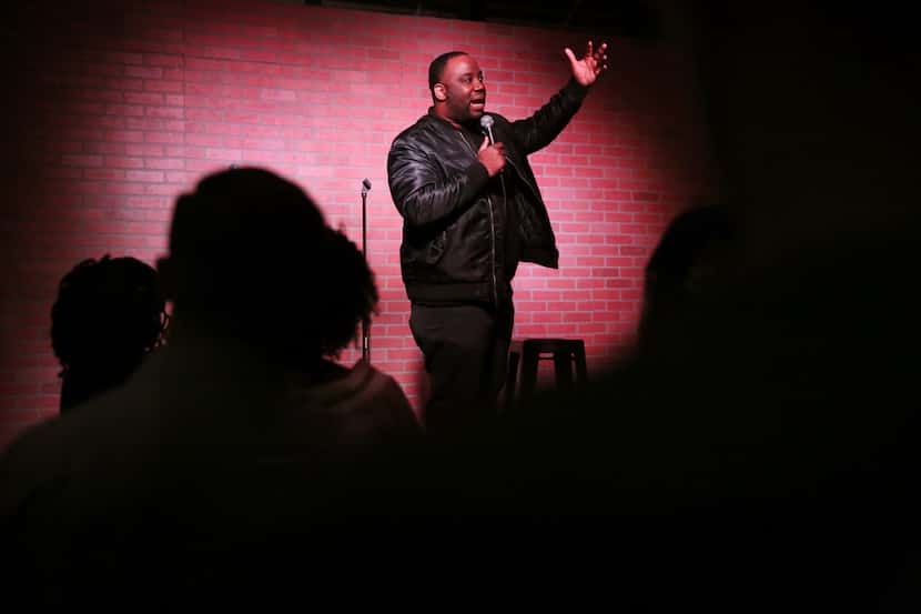 Local comedian Ku Egenti performs during open mike at The Secret Group in Houston on Dec....