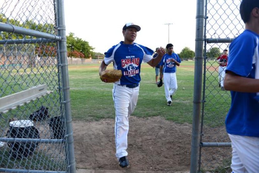 
Noah Moreno of the Junior South Garland Allstars exits the field for a water break during a...