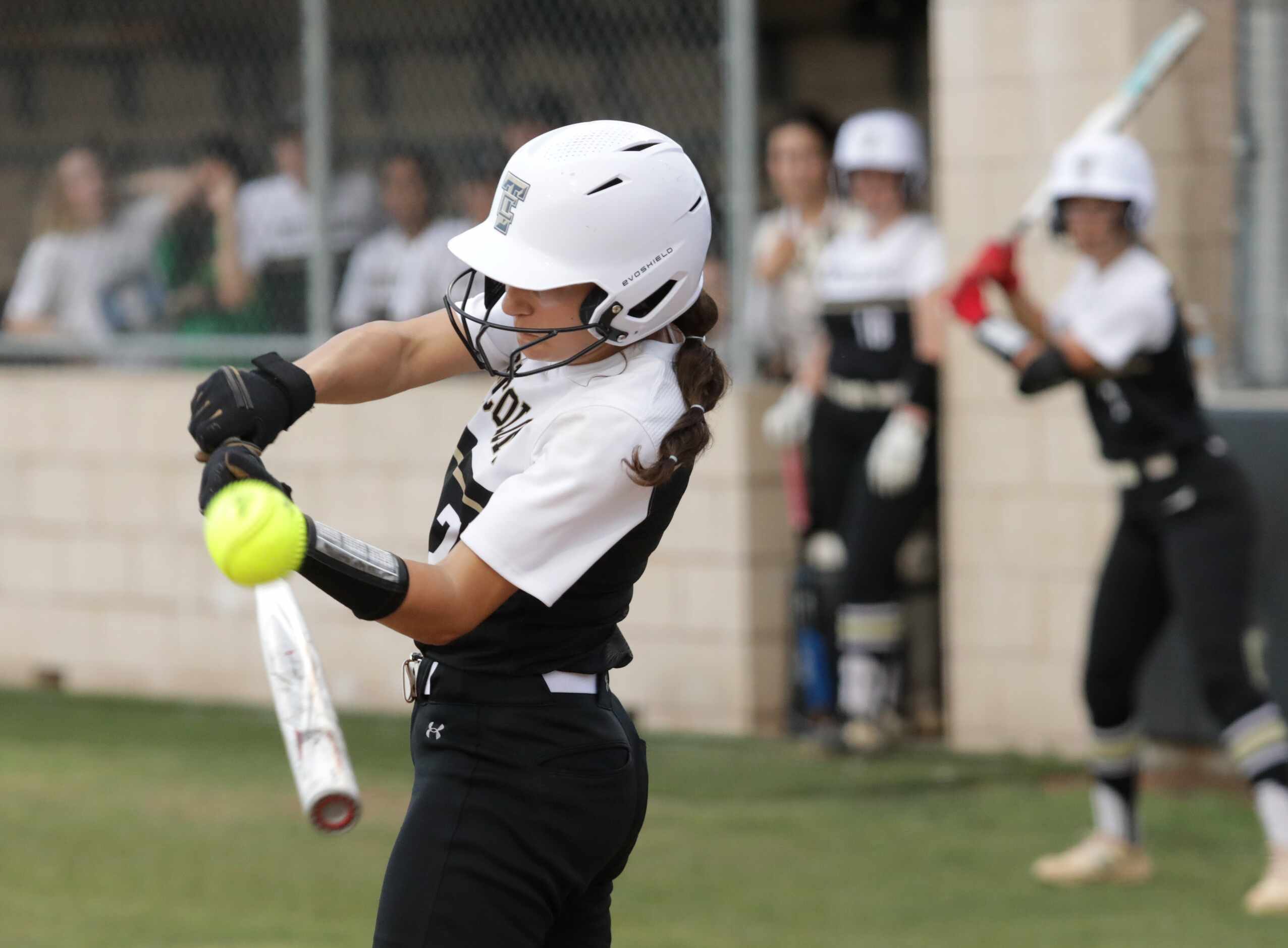 The Colony High School #7, Sabrina Wick, attempts to hit the ball during a softball game...