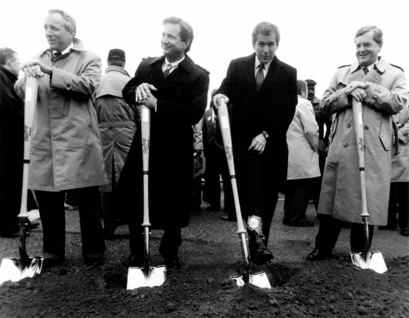 Rangers owner George W. Bush shows off his Texas Rangers cowboy boots after the ground...