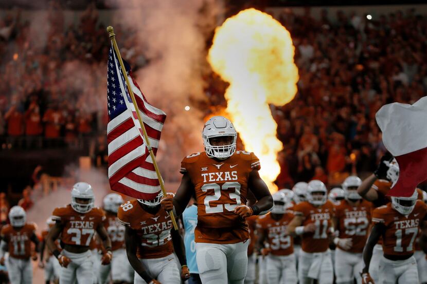 Texas Longhorns Jeffrey McCulloch (23) runs onto the field before the first half of the NCAA...