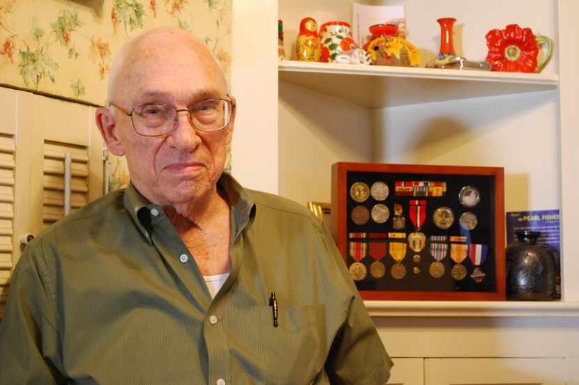 Pearl Harbor and Pacific War veteran Jim Hardwick is shown with his wartime medals. (2011...