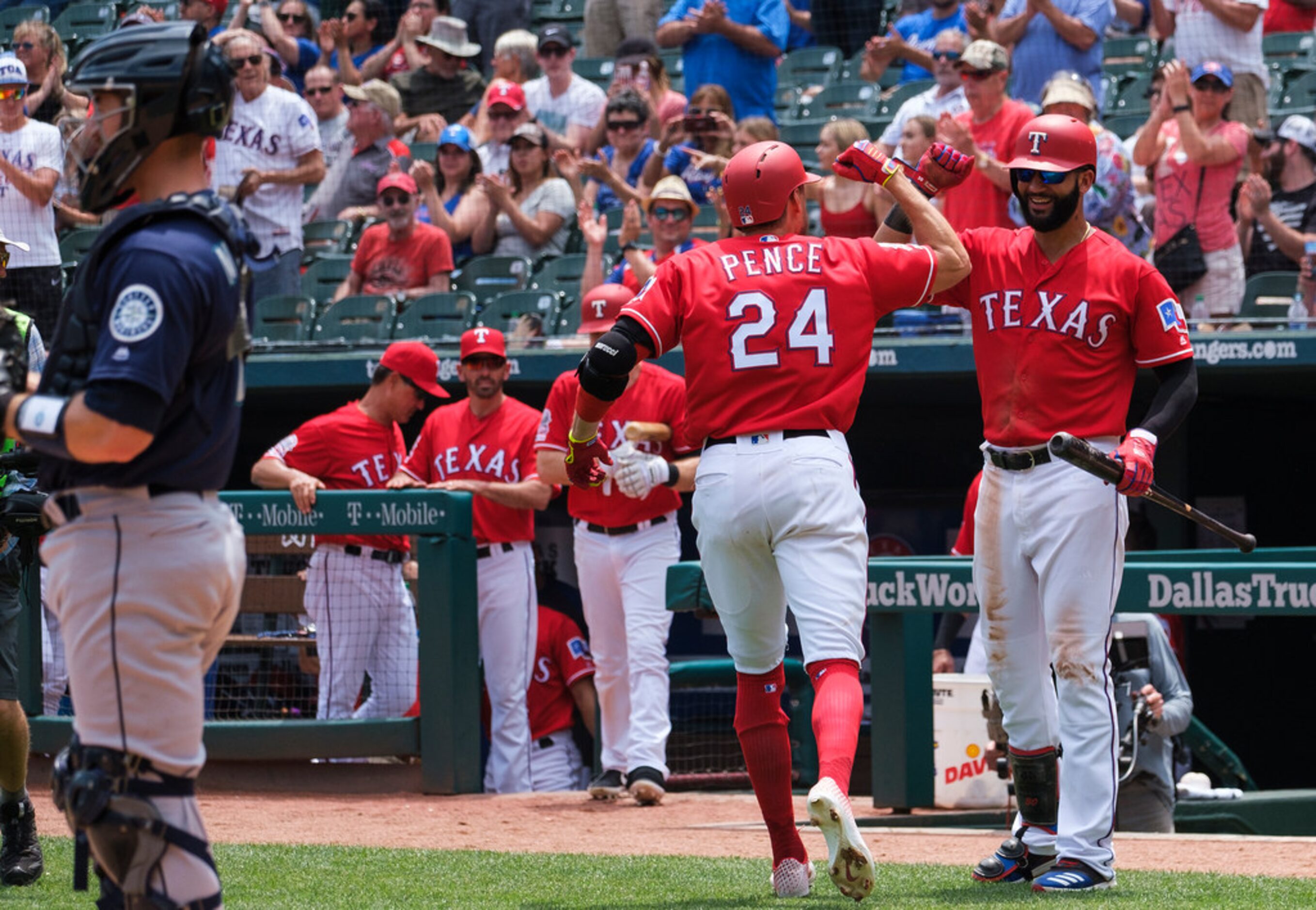 Texas Rangers designated hitter Hunter Pence celebrates right fielder Nomar Mazara after...