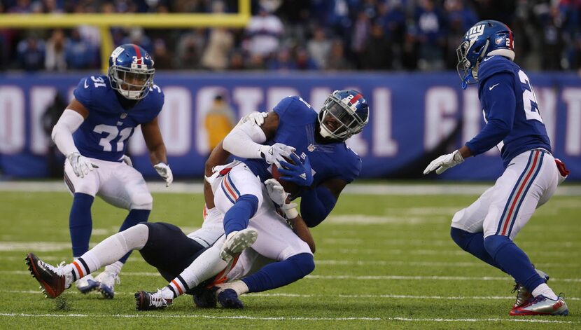 New York Giants strong safety Landon Collins (21) comes down with an interception against...