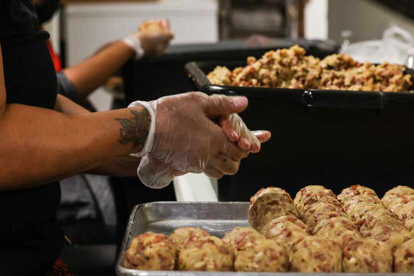 Teams of five to 10 people work shifts 24 hours a day to pre-make 100,000 gumbo balls before...