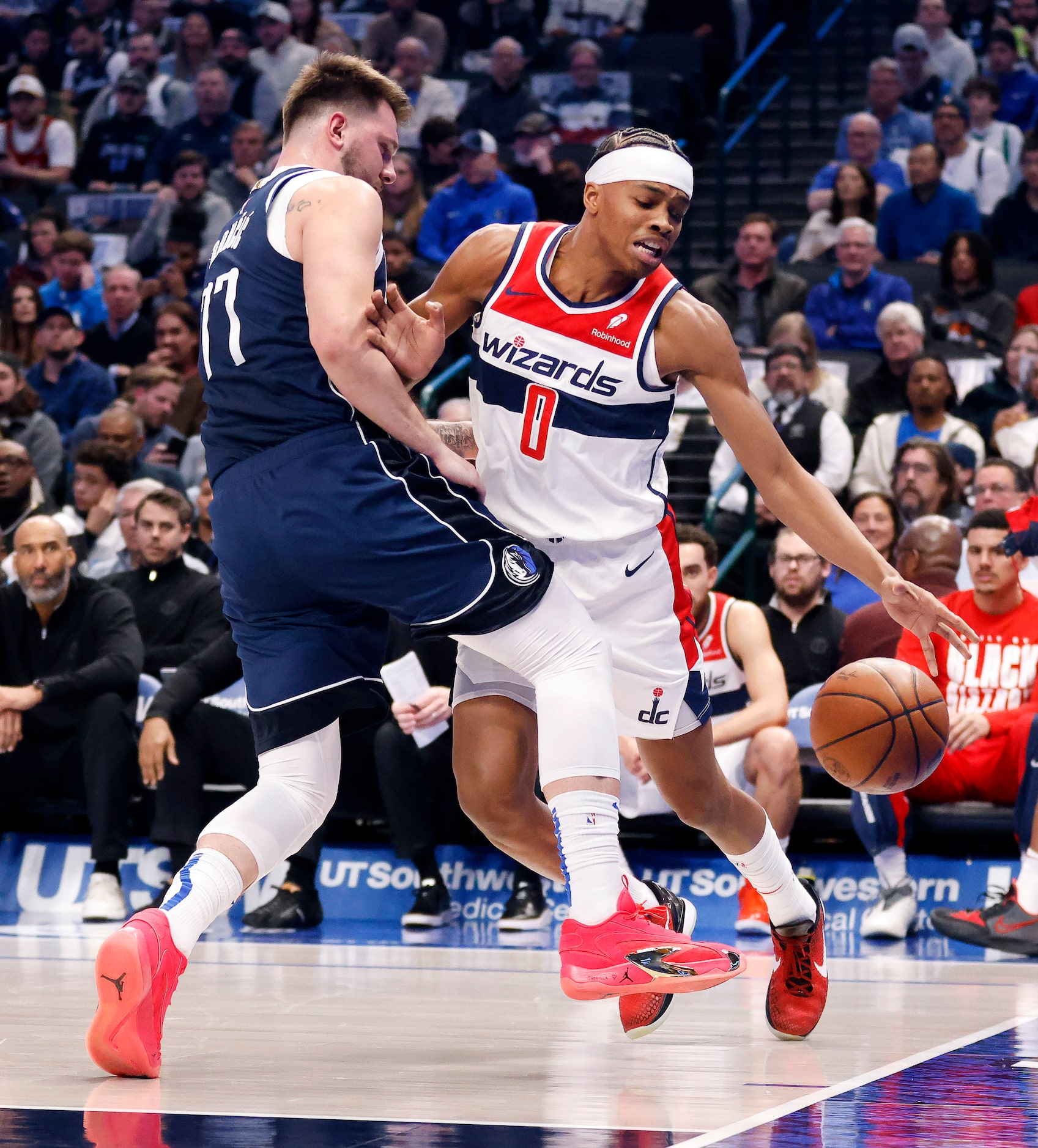 Dallas Mavericks guard Luka Doncic (77) fouls Washington Wizards guard Bilal Coulibaly (0)...