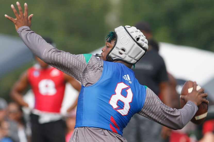 Arlington quarterback Kris Sims unleashes a long pass during the 7-on-7 state tournament in...