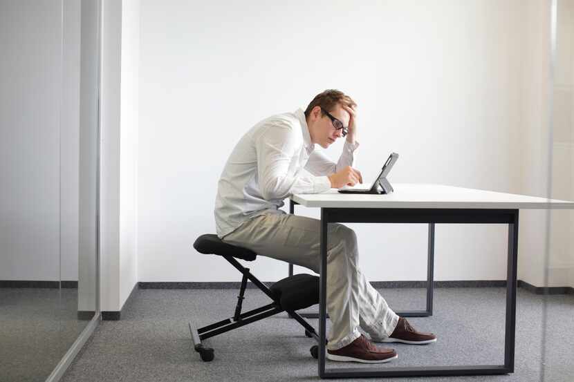 Bad posture at the computer or tablet can lead to back and neck discomfort.