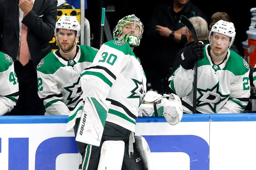 An exhausted, Dallas Stars goaltender Ben Bishop (30) looks over his shoulder towards the...