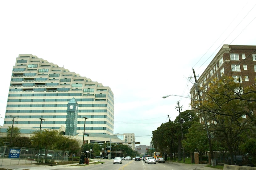 The Centrum tower in Oak Lawn, on the left, and an adding building sold to Oaktree Capital...