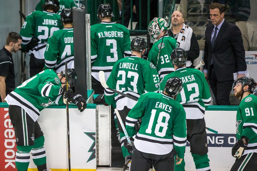 Dallas Stars left wing Jamie Benn (14) hands his head against the boards as the Stars head...