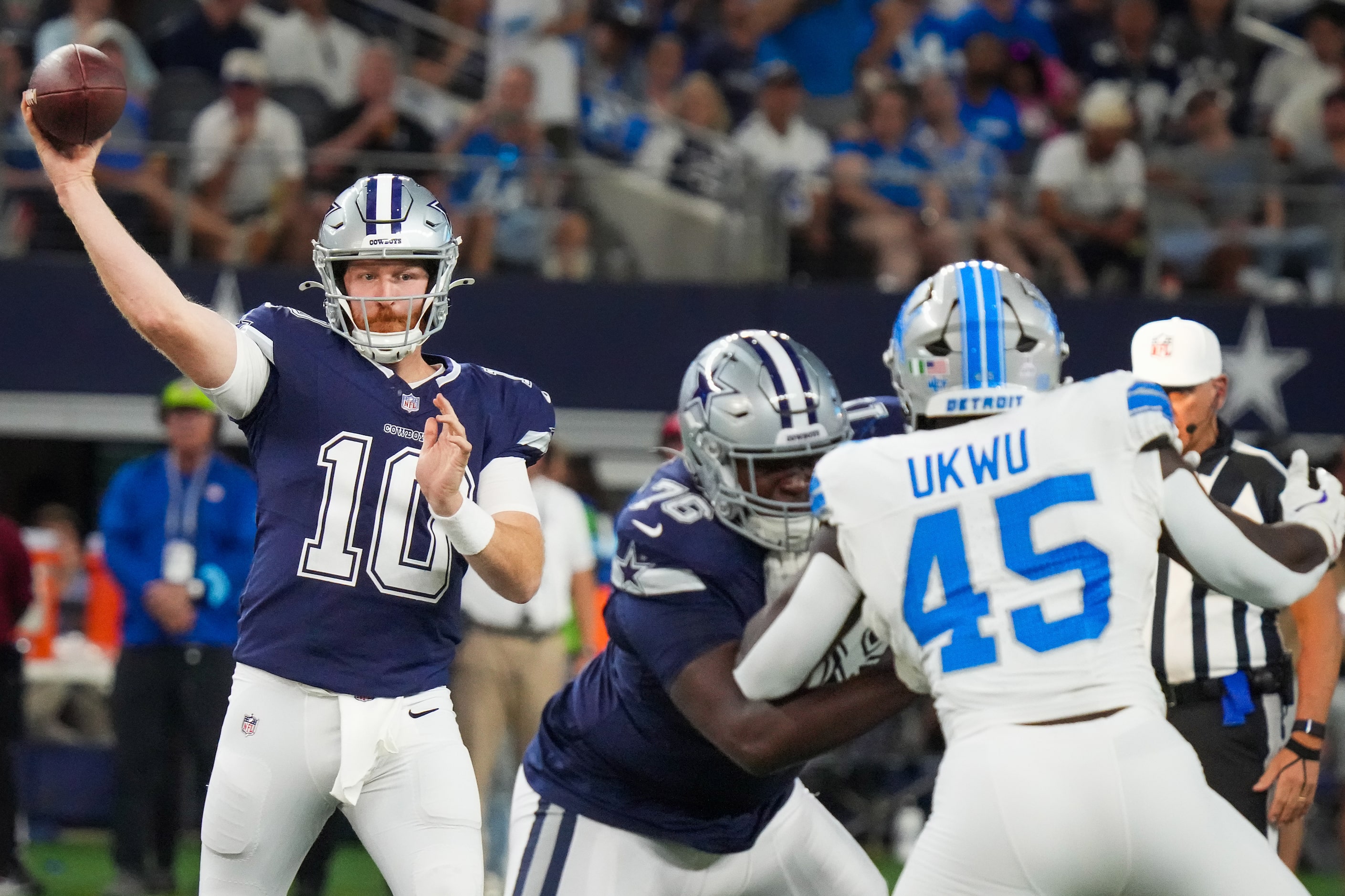 Dallas Cowboys quarterback Cooper Rush (10) throws a pass as offensive tackle Asim Richards...