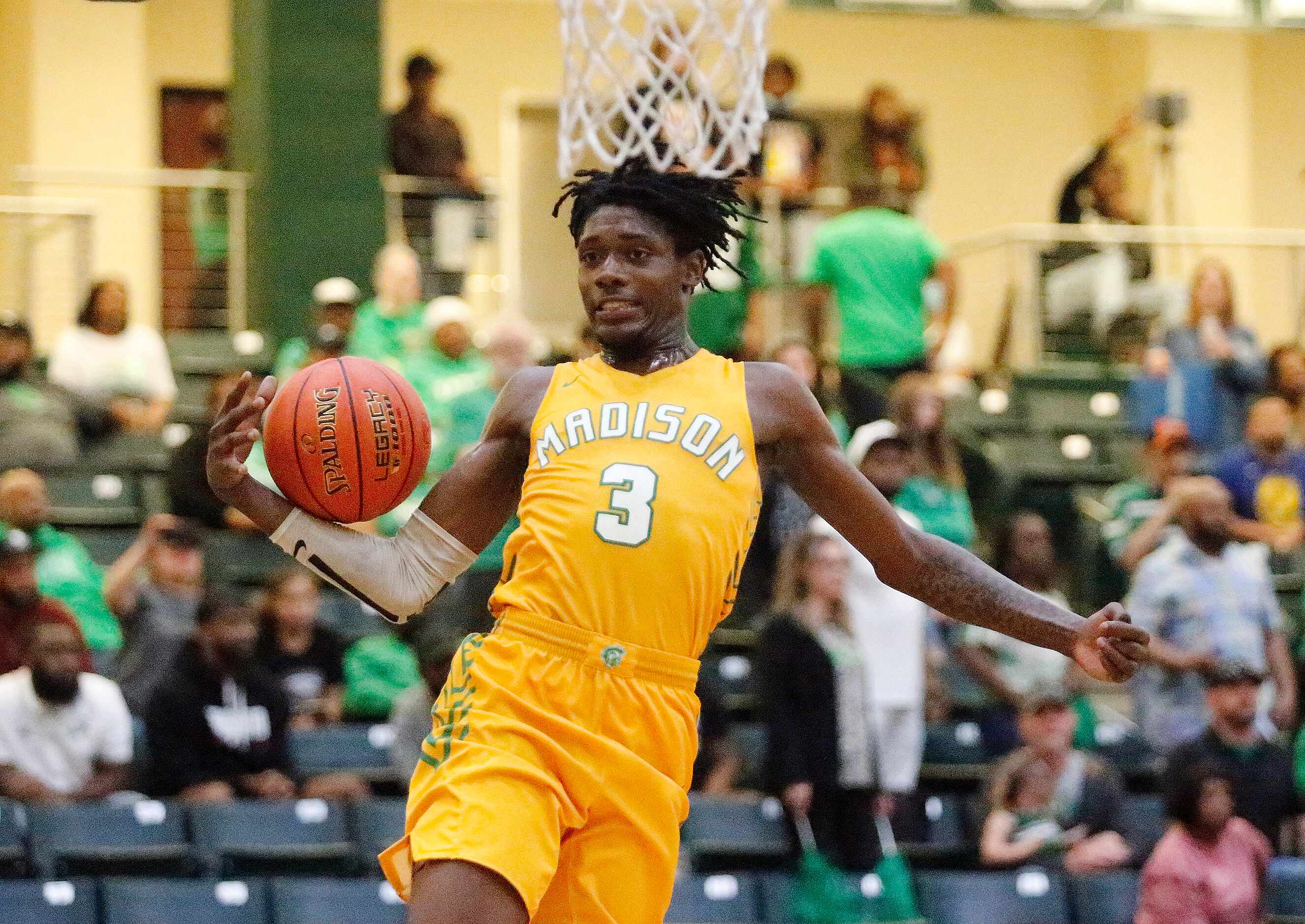 Madison forward Leonard Miles IV makes a shot attempt during the second half of the 3A...