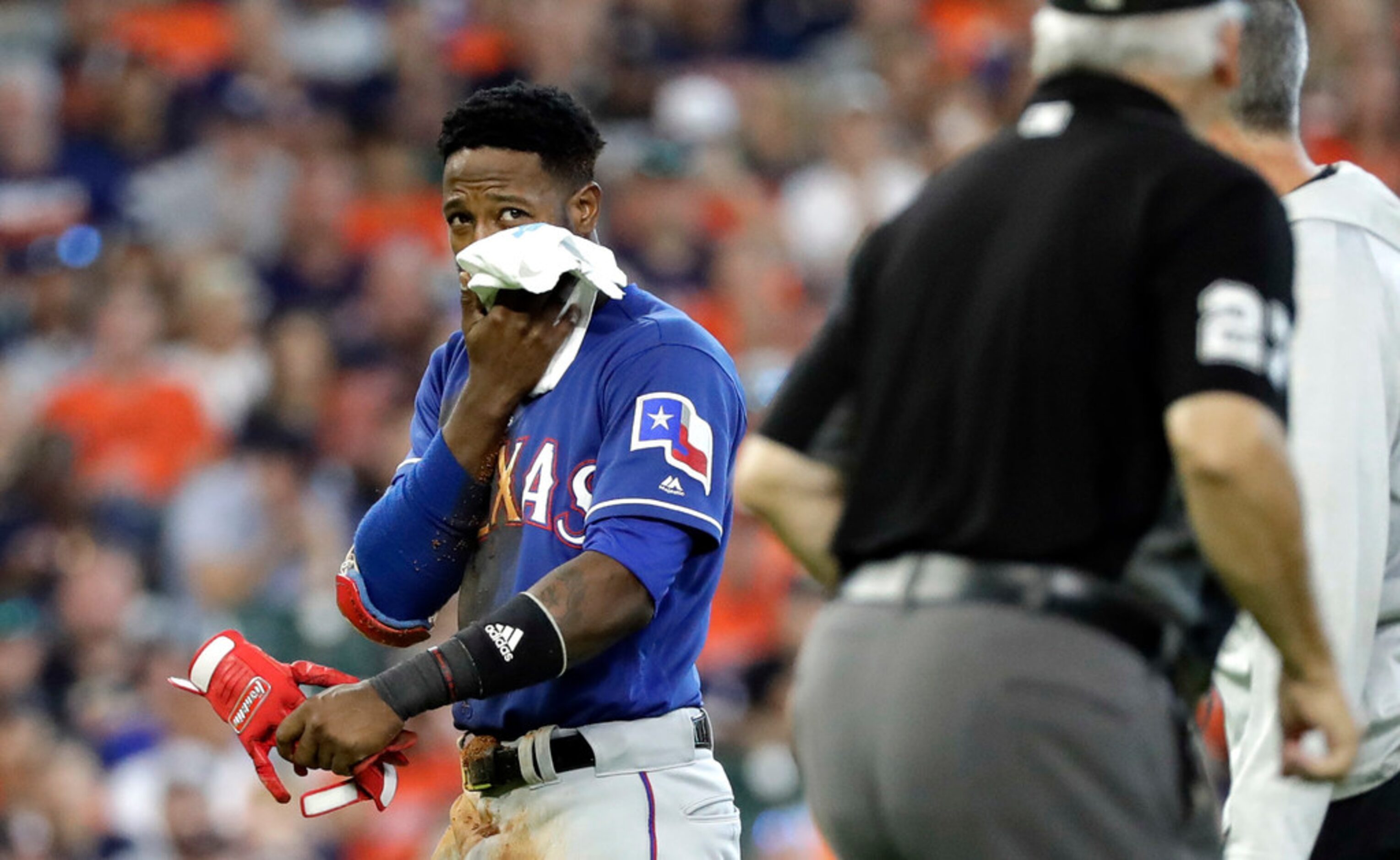 Texas Rangers' Jurickson Profar walks to the dugout after Houston Astros' Yuli Gurriel...