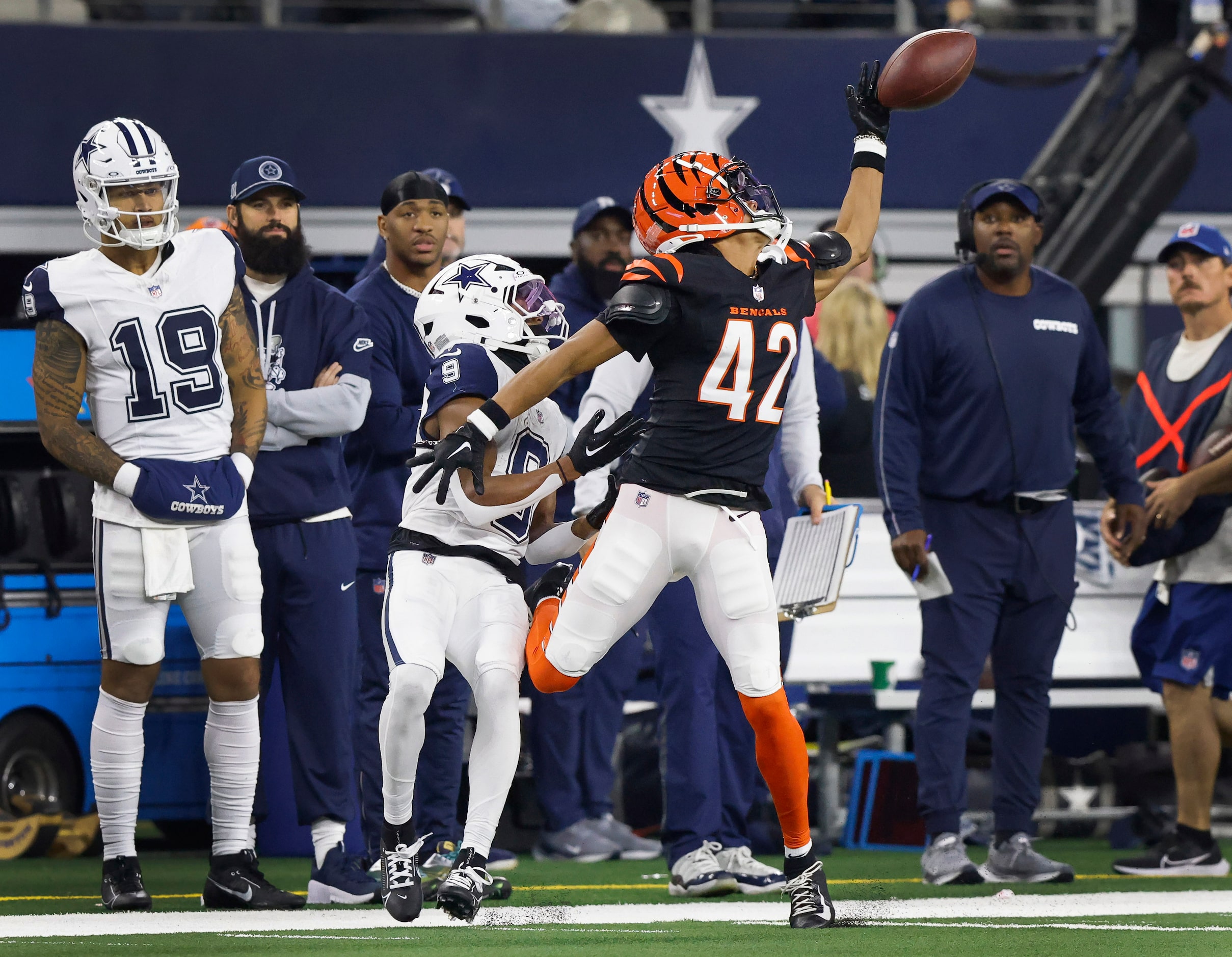 Cincinnati Bengals cornerback Marco Wilson (42) bats the ball away from Dallas Cowboys wide...