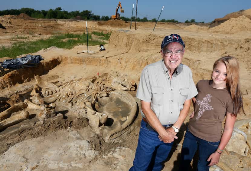 Wayne McEwen poses with granddaugther Halee Beasley, 13, at the site where he uncovered a...