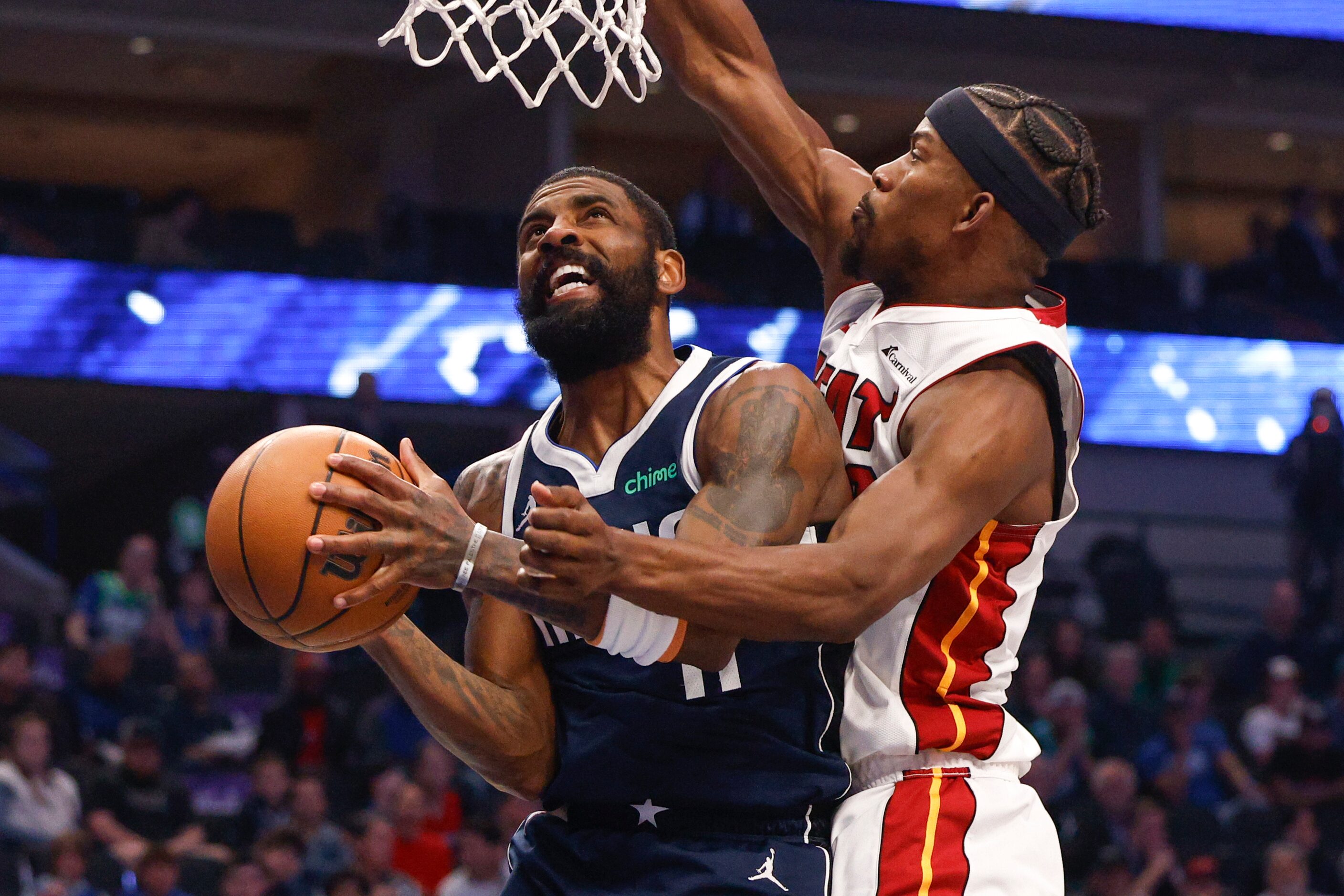 Dallas Mavericks guard Kyrie Irving (11) attempts a layup against Miami Heat forward Jimmy...