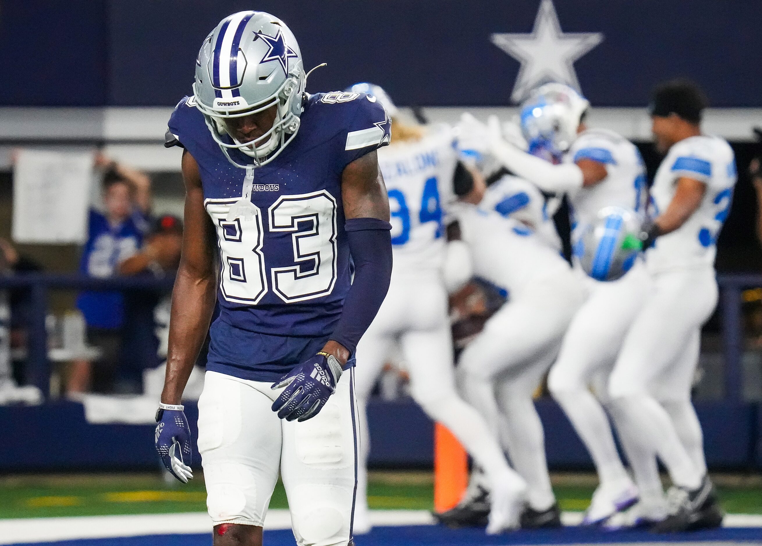 Dallas Cowboys wide receiver Jalen Brooks (83) walks off the field as Detroit Lions players...