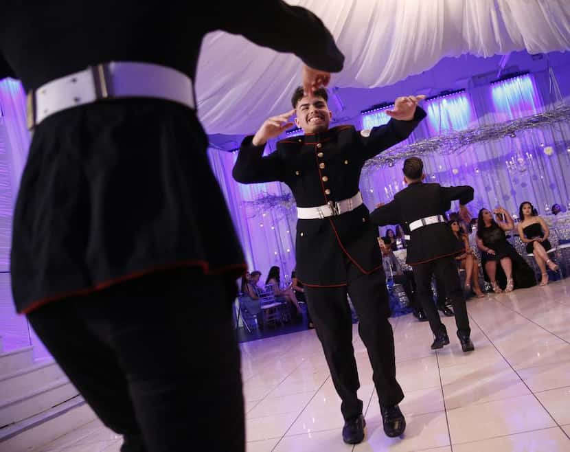 Edmundo Puente baila con los Latin Boyz Cadets durante una quinceañera en el Latino Ballroom...