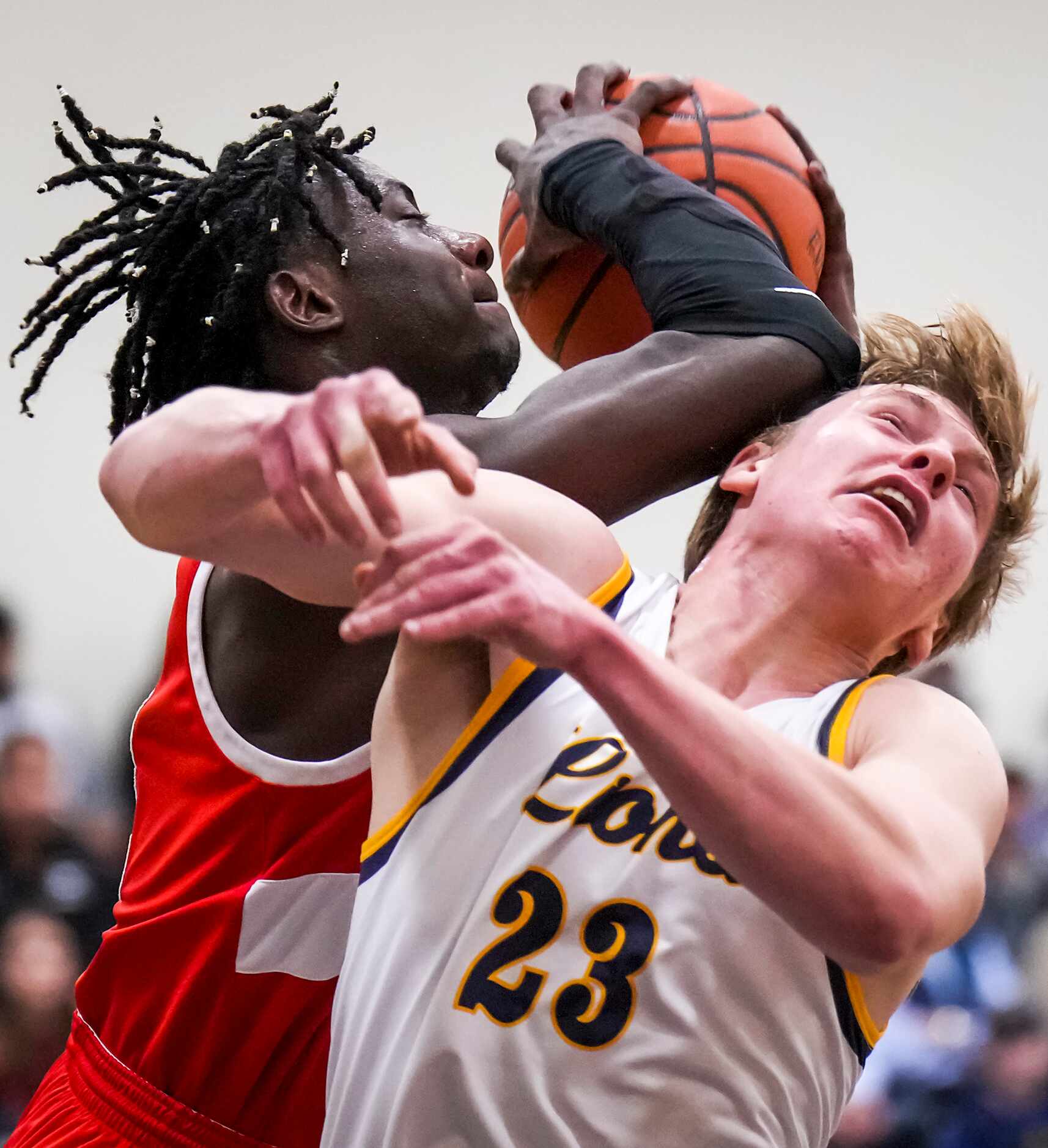 John Paul II's Elijah Obaseki (11) fights for a rebound against Prestonwood Christian's...