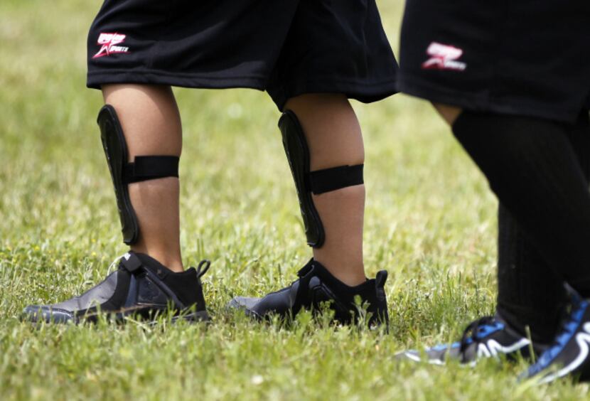 Raul’s cousin Fernando Villegas, 9, played in short socks and basketball shoes for the last...