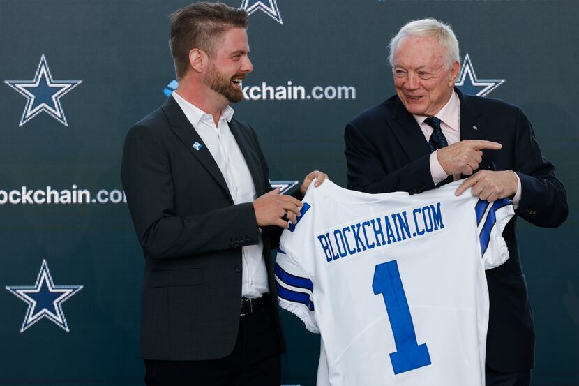 Blockchain.com co-founder and CEO Peter Smith, left, and Dallas Cowboys owner Jerry Jones...