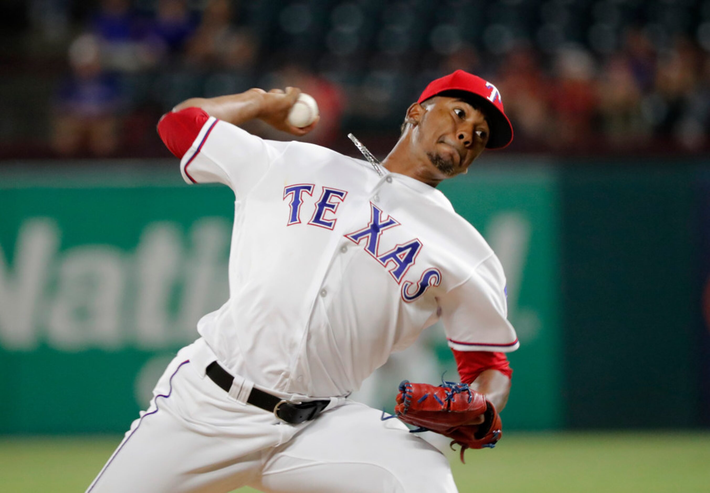 Texas Rangers' Emmanuel Clase throws to the Los Angeles Angels in the 10th inning of a...