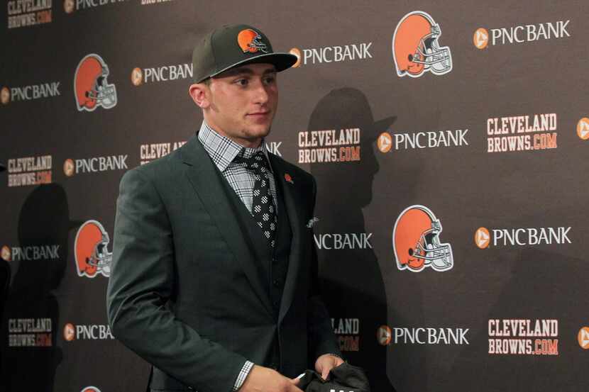 Cleveland Browns first round draft choice Johnny Manziel arrives for a news conference with...