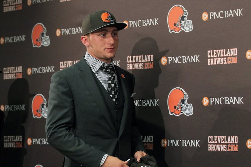 Cleveland Browns first round draft choice Johnny Manziel arrives for a news conference with...