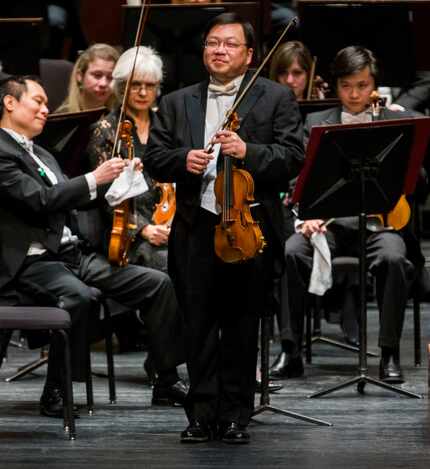 Concertmaster Michael Shih takes a bow before performing with the Fort Worth Symphony...