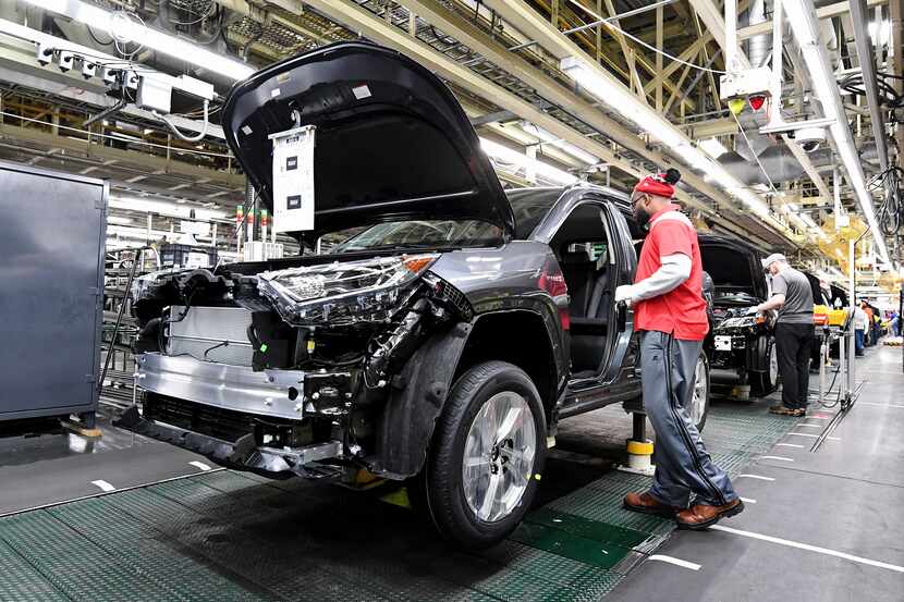 A Toyota Rav4 Hybrid rolls along the assembly line in Georgetown, Ky.