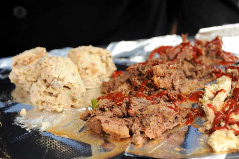 The Blessing Catering serves brisket and potatoes at Taste of Dallas in Fair Park in Dallas ...