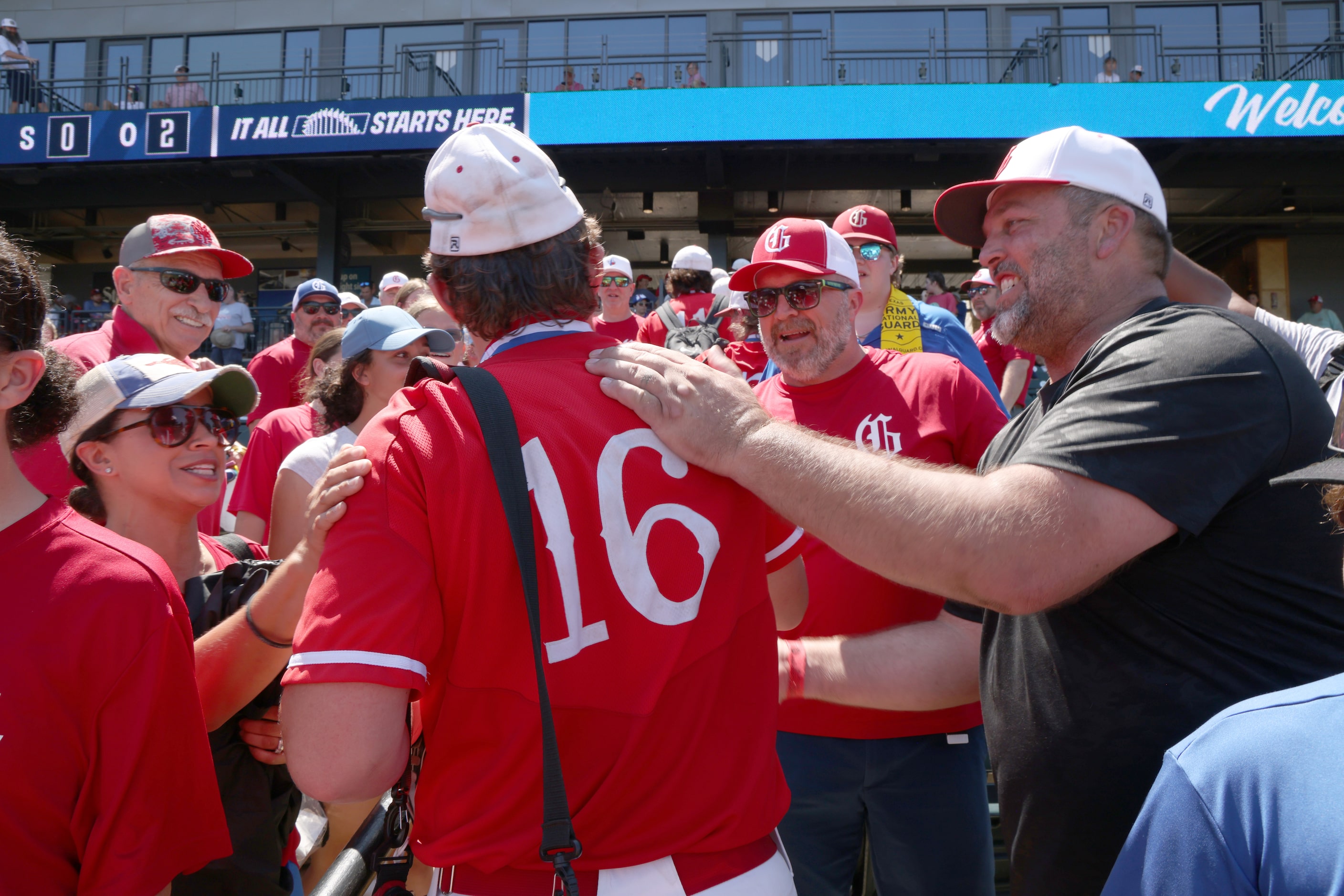 Fans greet Grapevine players including pitcher Luke Schreyer (16) after the Mustangs' 6-5...