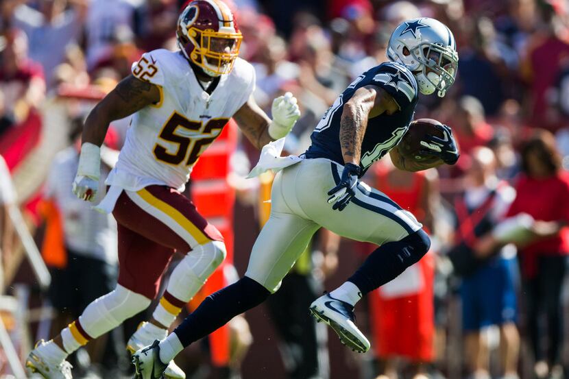 Dallas Cowboys wide receiver Devin Smith (15) runs the ball ahead of Washington Redskins...