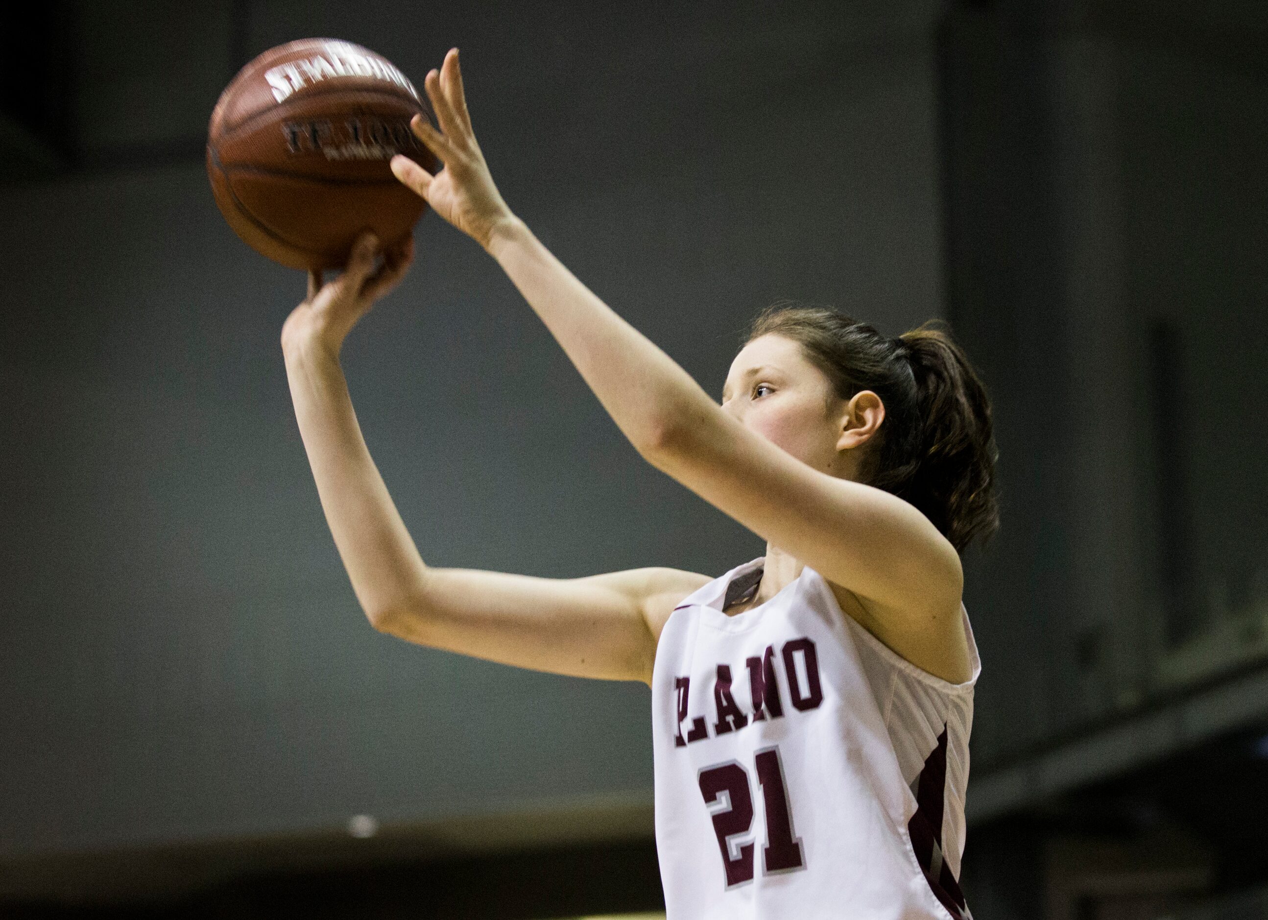 Plano forward Josie Bruder (21) takes a shot during the second quarter of a UIL 6A Region II...