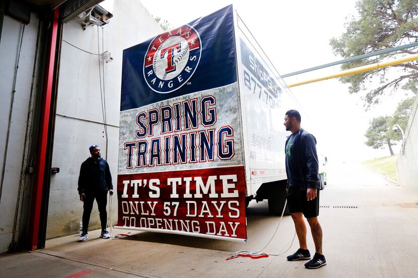 Texas Rangers outfielder Delino DeShields (left) and catcher Isiah Kiner-Falefa drop the...