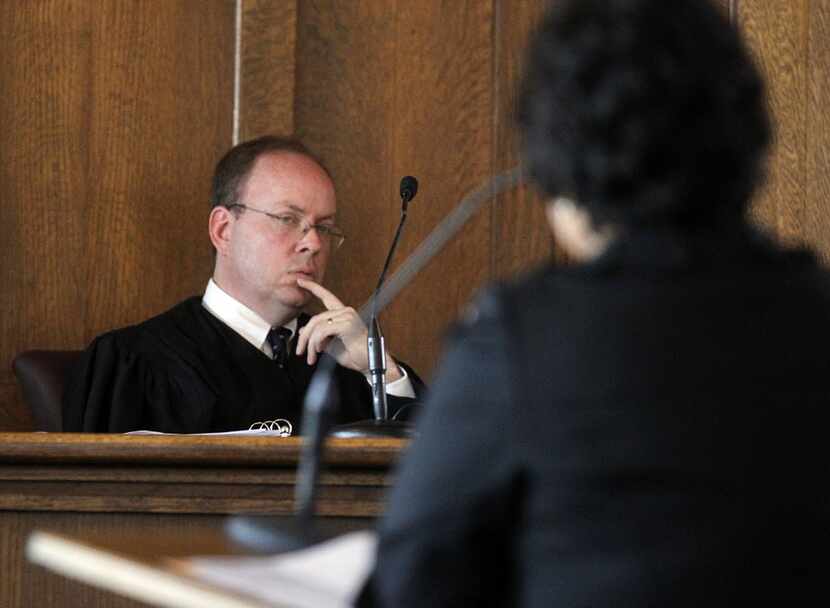 State District Judge Martin Hoffman (68th District Court of Dallas County)  listens as U.S....