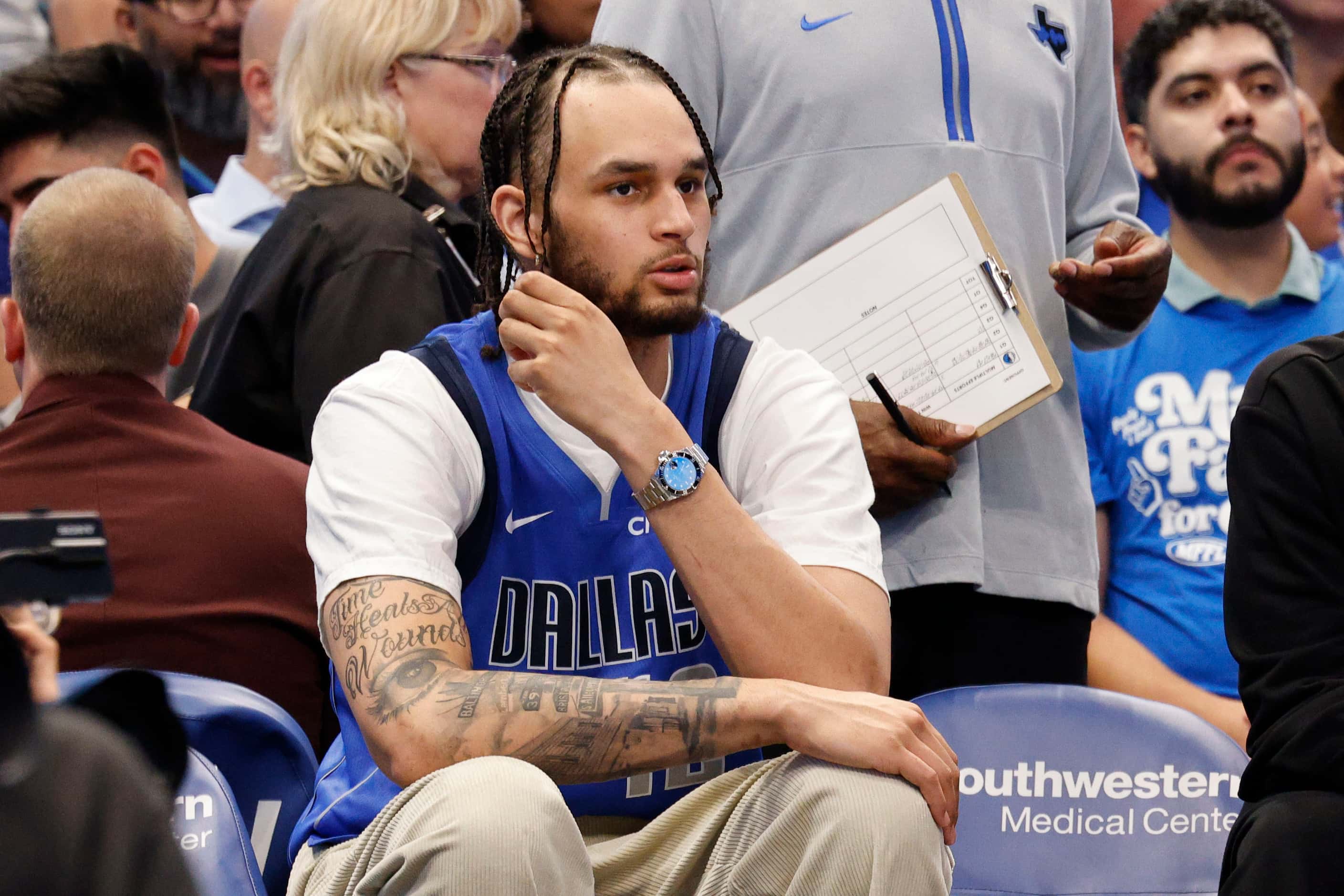 Dallas Mavericks center Dereck Lively II sits in the bench during the second half of an NBA...