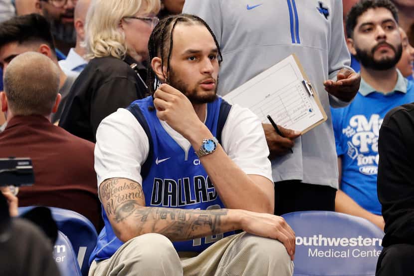 Dallas Mavericks center Dereck Lively II sits in the bench during the second half of an NBA...