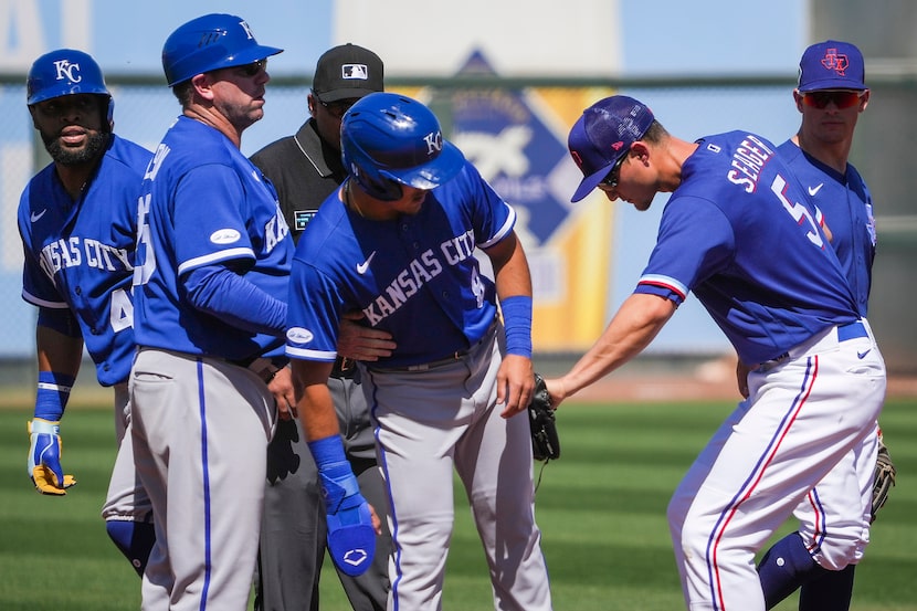 Texas Rangers shortstop Corey Seager (5) puts a tag on Kansas City Royals second baseman...