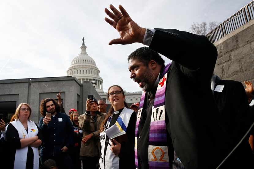 The Rev. William Barber II, with the "Poor People's Campaign," speaks to the group after...