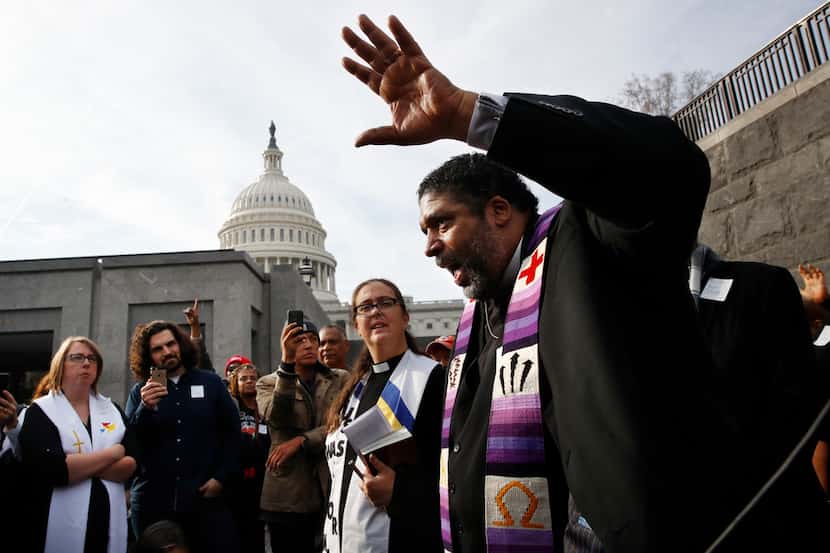 The Rev. William Barber II, with the "Poor People's Campaign," speaks to the group after...