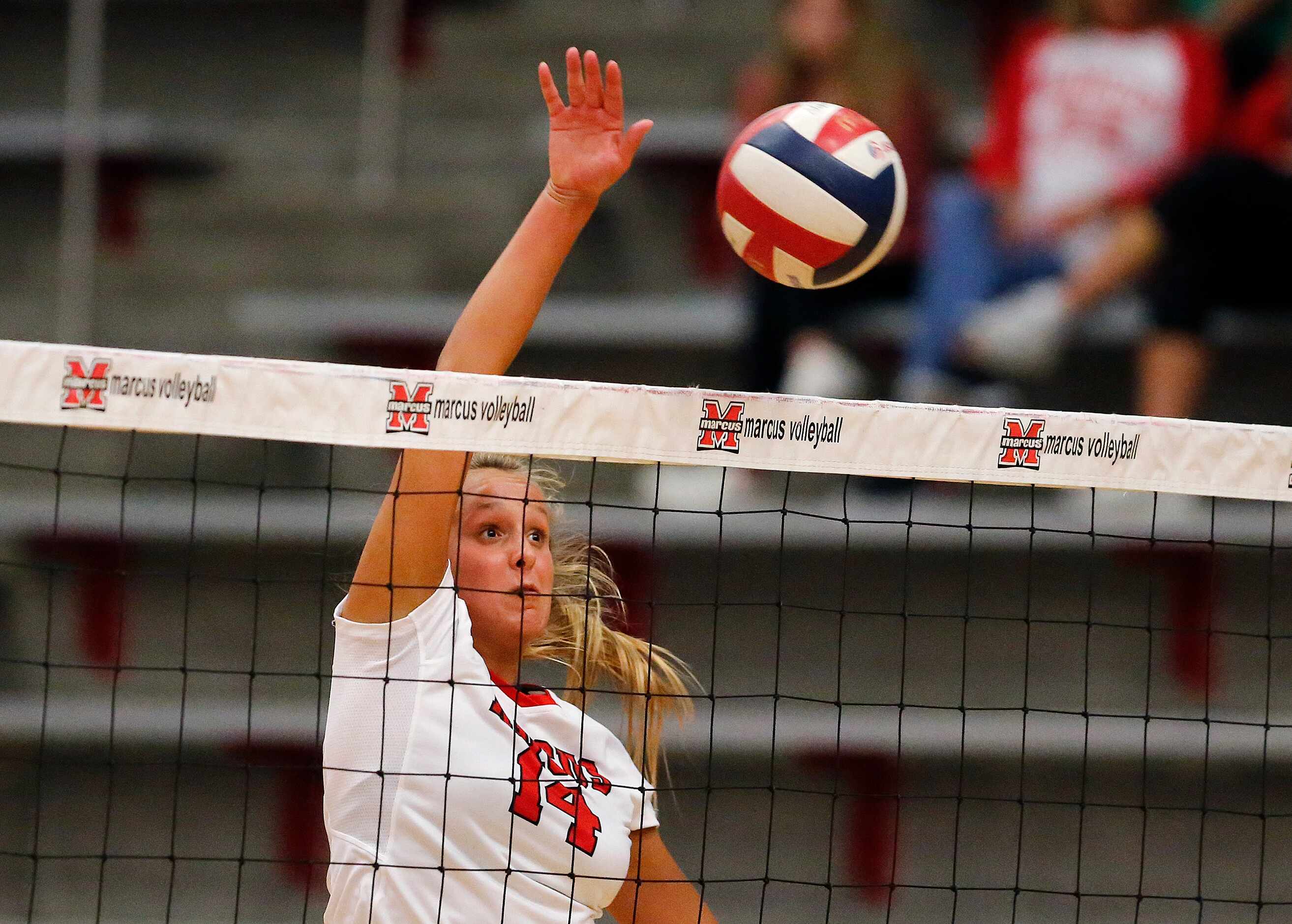 Marcus outside hitter Maggie Boyd (14) scores on a hit in game one as Flower Mound Marcus...