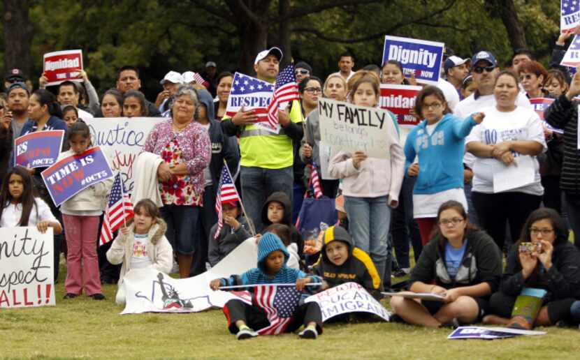 At Reverchon Park, rally participants listened to speakers before proceeding downtown.