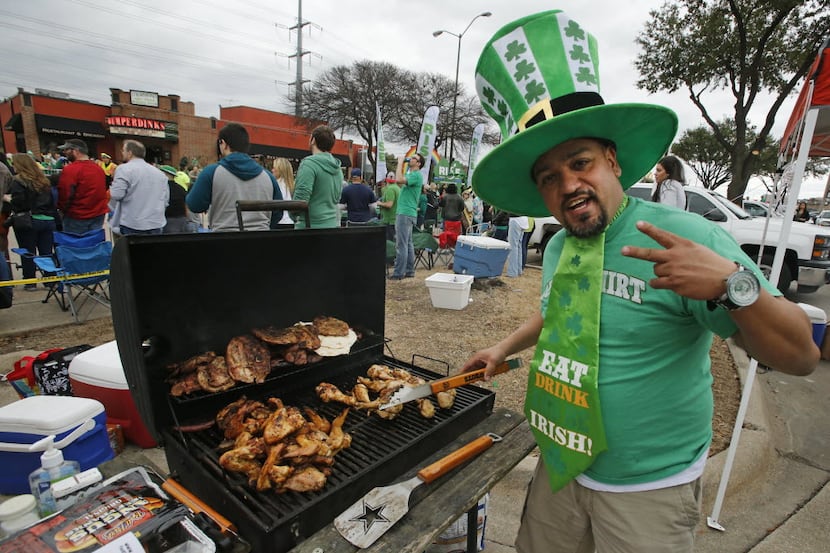 Joe Esquivel of Dallas mans the grill during St. Patrick's Day Parade on Greenville Avenue...